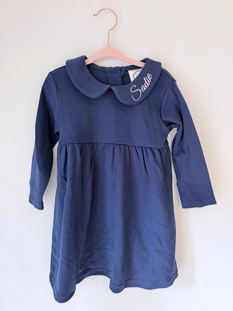 Navy dress with Sadie in white script on the collar